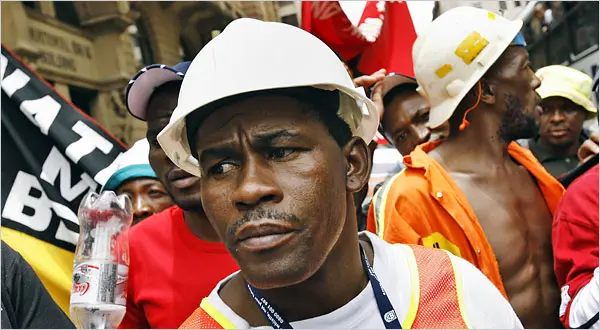 South African workers raising fists in solidarity